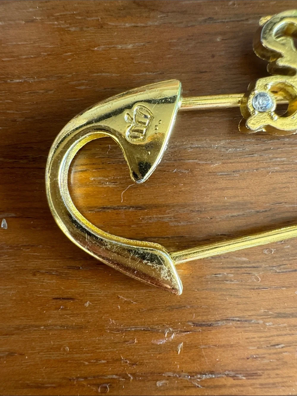 Juicy Couture Gold-Tone Script Safety Pin Brooch with Crystal Accents